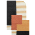 A modern abstract area rug with a geometric block pattern in black, cream with tan stripes, terracotta, ochre, and mustard tones, shown on a plain white background.