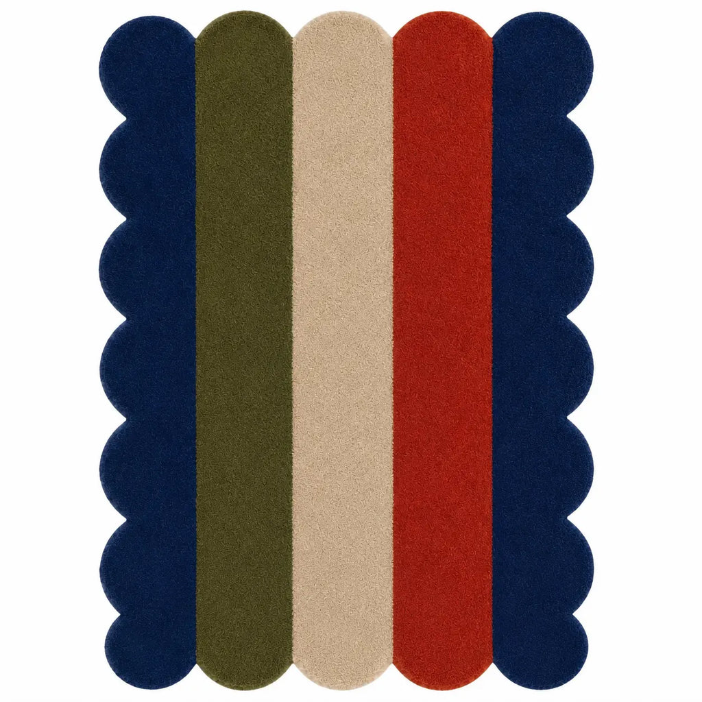 A rectangular area rug with a scalloped edge and vertical stripes in navy blue, olive green, beige, and red on a white background.