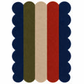 A rectangular area rug with a scalloped edge and vertical stripes in navy blue, olive green, beige, and red on a white background.
