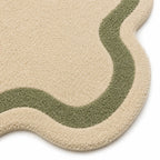 Beige and green textured rug on a white background