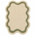Beige rug with green border on a white background