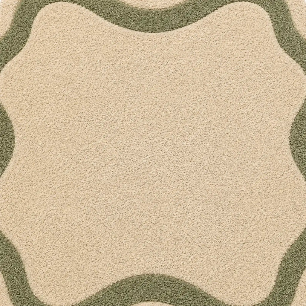 Close-up of a beige and green patterned rug