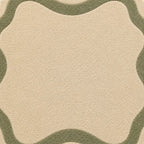 Close-up of a beige and green patterned rug
