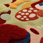 Colorful abstract rug with various shapes and patterns