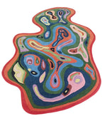 Colorful abstract rug with wavy patterns on a white background