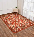 Luxury artisan rug in orange with beige and grey floral motifs