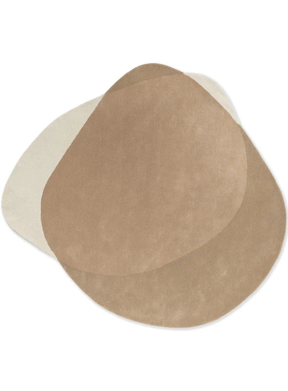 Two beige circular coasters on a white background